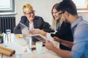 Business partners reviewing accounts with Exeter accountant - Sidaways